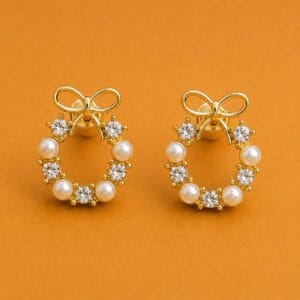 Roselle pearl bow earrings with clear stones