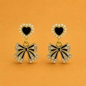 Heart and bow statement earrings with black and pearl details