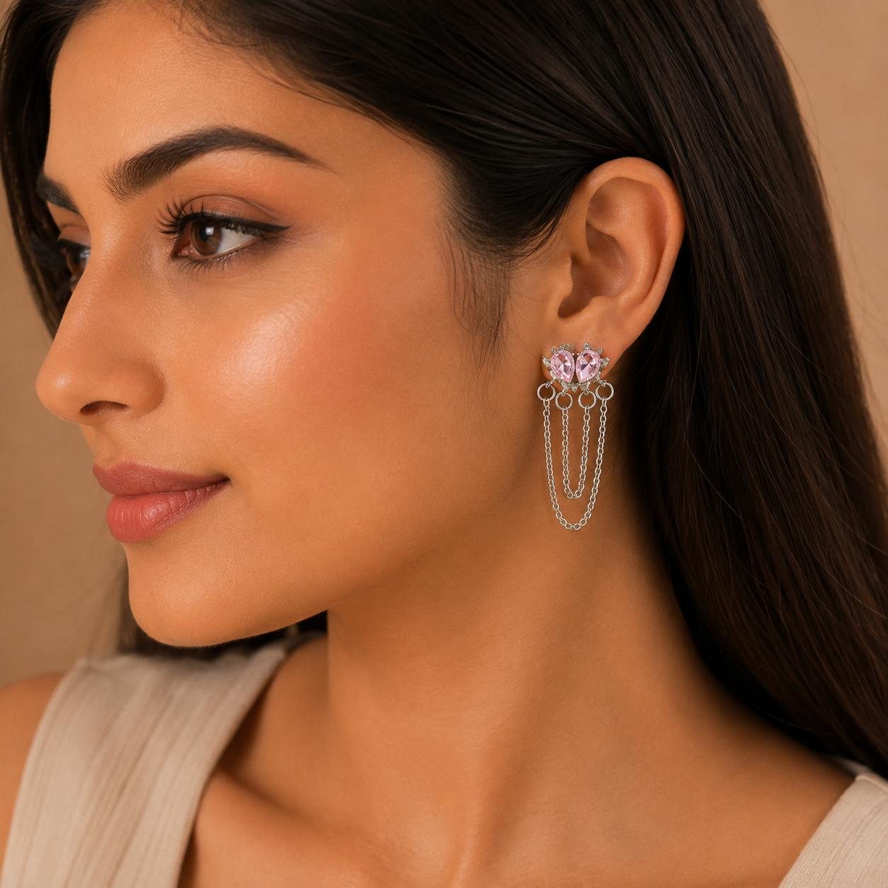 Woman wearing pink crystal chain drop earrings